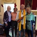Spiritual leaders Raphaelle & Michael Tamura and Dr. Nina Meyerhof bless the violin